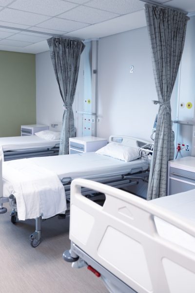 General view of an empty hospital room with three beds. medicine, health and healthcare services.