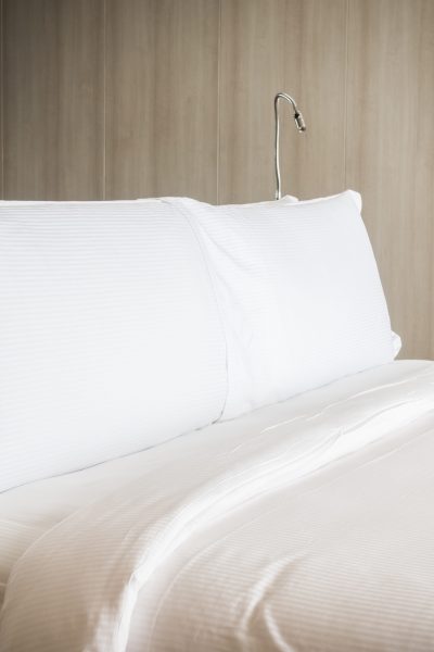 White pillow on bed decoration in bedroom interior